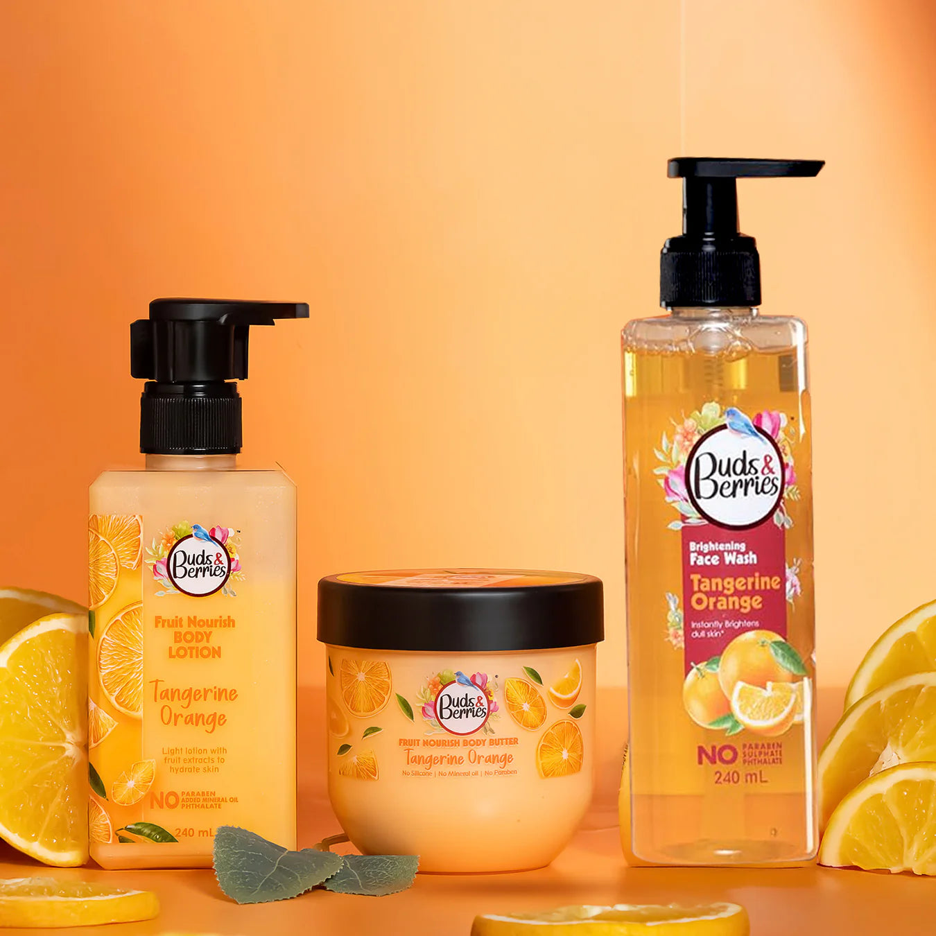 Buds & Berries Tangerine Orange body lotion, body butter and brightening face wash product banner.